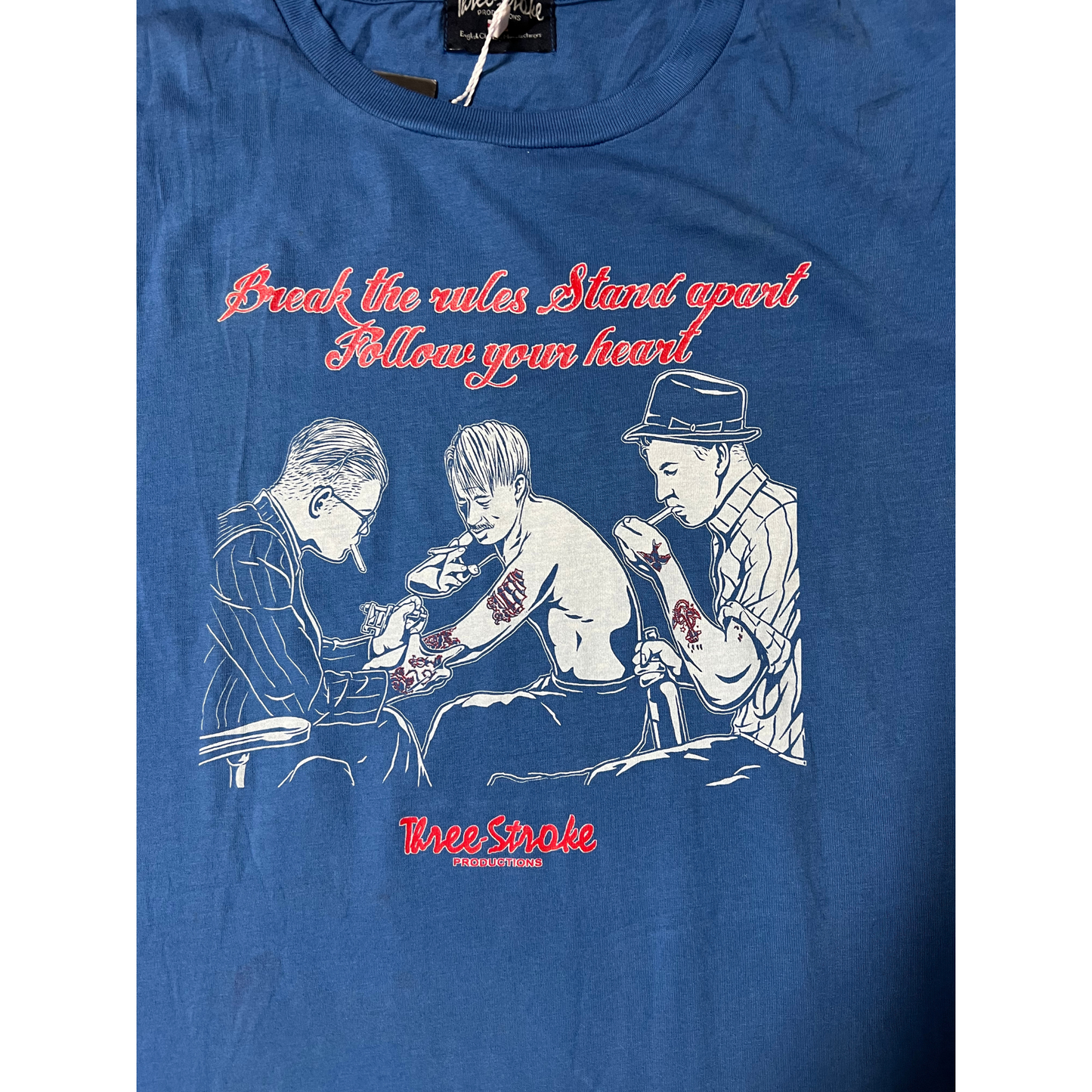 THREE STROKE- T-shirt azzurra con stampe